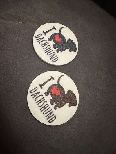 %{de_profession_title}-Zwei  Untersetzer mit Dackel-Bild