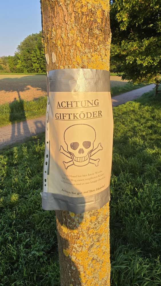 Giftköder-Schild mit Warnung vor Köder-Profilbild